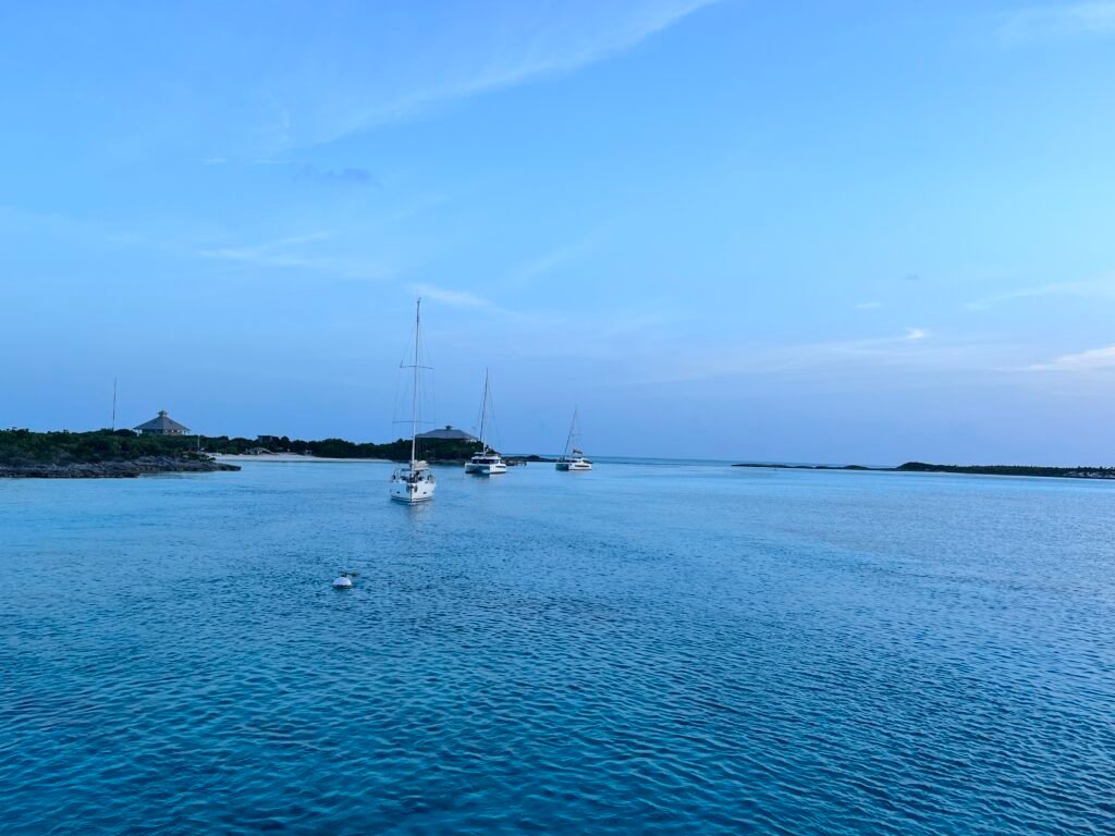 three sailboats in the harbor at Warderick Wells Cay in Exuma Bahamas