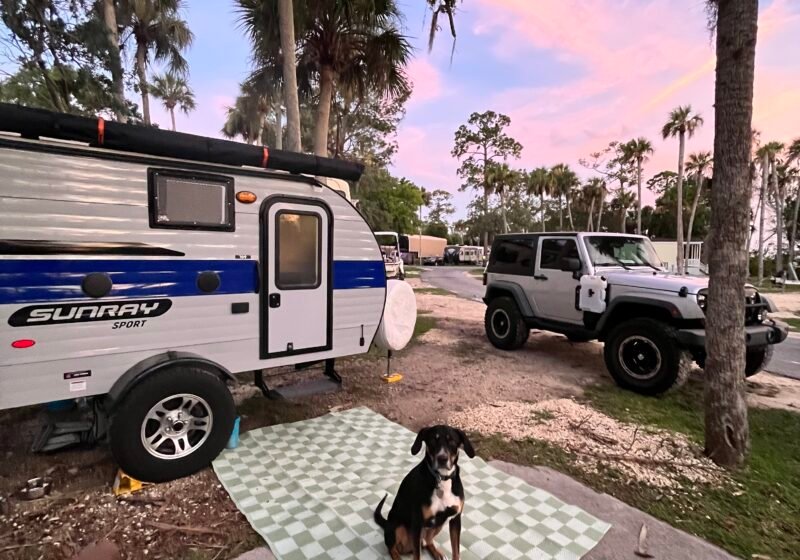 Sunray 109 Sport Travel Trailer in front of a cotton candy colored sky